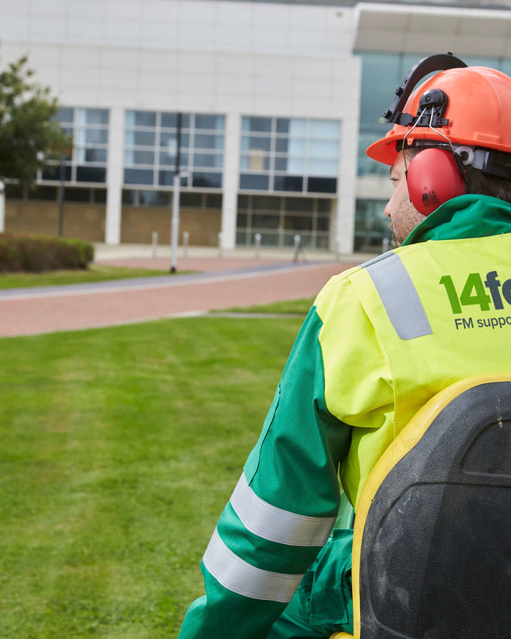 A member of the 14forty outdoor hard facilities management team performing maintenance work.