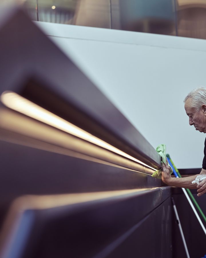 A member of 14forty's facility management support services team cleaning an office facility.